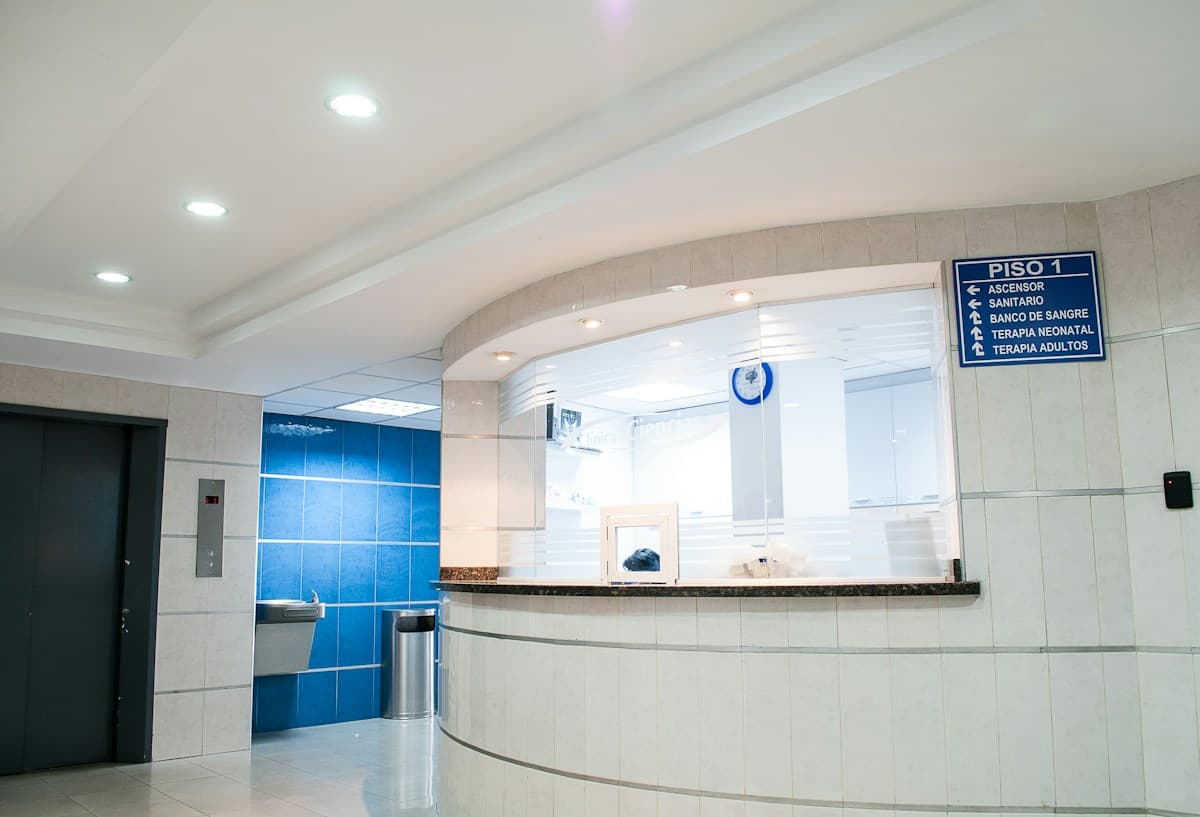 Bright, comfortable waiting area with seating, plants and natural light